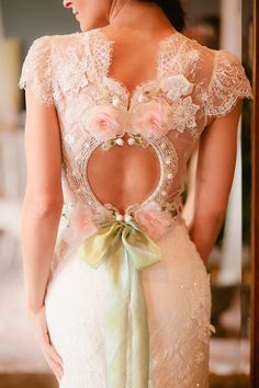 the back of a woman's dress with flowers on it