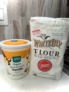 an ice cream and yogurt are sitting on the counter next to each other