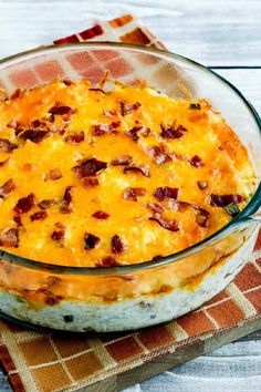 a casserole dish with bacon and cheese in it