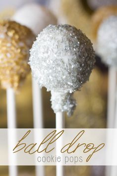 three cake pops with white frosting and gold sprinkles are on a stick in front of the words, ball drop cookie pops