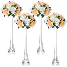 three tall vases filled with white and orange flowers