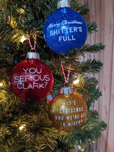 three christmas ornaments hanging from a tree with the words you serious clark written on them