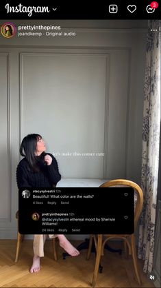 a woman sitting on top of a wooden chair in front of a whiteboard with the words instagram