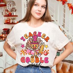 Thanksgiving Kindergarten Teacher Shirt, Turkey Gobble Squad Kindergarten Teacher Shirt, One Thankful teacher, Autumn Fall Gift For Teacher Welcome to QuartzStone Shop! Thank you for choosing us among many other excellent sellers HOW TO ORDER 1. Select the shirt 𝗦𝘁𝘆𝗹𝗲-𝗦𝗶𝘇𝗲 2. Select the shirt color 3. Select the quantity 4. Fill out your personalized information or leave us any note (if any) 5. Click 𝗔𝗗𝗗 𝗧𝗢 𝗖𝗔𝗥𝗧. If you want to buy more than one, please go back to the listing and repeat the steps. "If you have any question, please send us a message." BRAND  If you want a specific brand, please send us a message right after you place the order. Otherwise, we will send you the t-shirt according to what we have in stock. SIZE CHART We suggest you choose the size you usually Sweater Drying Rack, Thanksgiving Kindergarten, Kindergarten Teacher Shirts, Kindergarten Teacher, Fall Gifts, Gift For Teacher, Kindergarten Teachers, Text Design, Autumn Fall