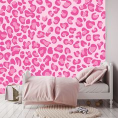 a pink leopard print wallpaper in a bedroom