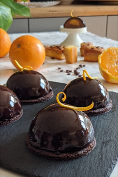 chocolate desserts with orange slices on the side