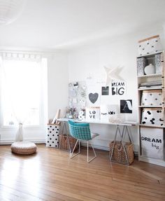 a room with white walls and wooden floors