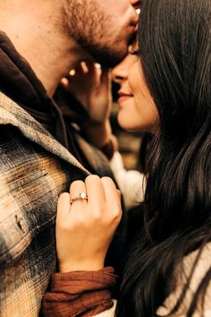 a man and woman standing close to each other