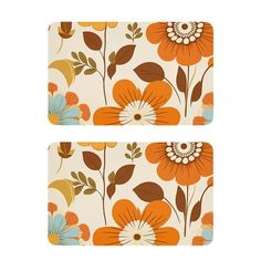 two placemats with orange and blue flowers on them