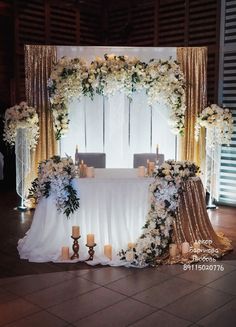 a table with flowers and candles on it