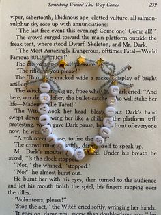 a book page with an image of a bracelet on it