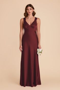 a bridesmaid in a long burgundy dress