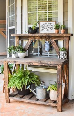 a potted plant sitting on top of a wooden shelf next to a window with shutters