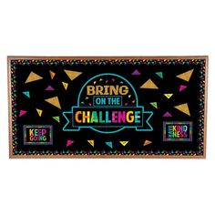 a sign that says bring on the challenge with colorful confetti and streamers