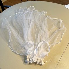 there is a white veil on the table