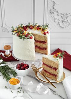 two pieces of cake with berries on top and one slice cut from the other side