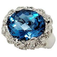 Luxury Fine Jewelry Topaz Ring Collectible, Luxury Polished Blue Topaz Ring, Luxury Blue Topaz Ring With Polished Finish, Luxury Oval Topaz Ring With Gemstone Accents, Blue Diamond Ring With Gemstone Accents, Oval Shape, Blue Oval Diamond Ring With Gemstone Accents, Topaz And Diamond Ring, Ring With Diamond, Pretty Rings