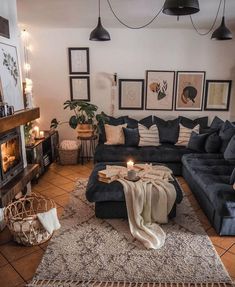 a living room filled with lots of furniture next to a fire place on top of a hard wood floor