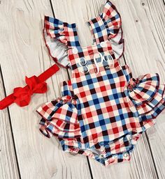 This is an adorable checkered romper with an option with your personalization on it or you can choose to leave blank.  This romper is made from a cotton blend soft terylene spandex fabric.  The colors in person are gorgeous. These are red white and off white or cream.  Personalization is made from a Vinyl cut machine so the name is cut out of vinyl.  The name is done in a white vinyl or you can specify Plastic backing is removed. Sample photos show a plastic backing. Please note Headband is sold Plaid Cotton Bubble Romper For Summer, Summer Cotton Plaid Bubble Romper, Summer Plaid Cotton Bubble Romper, Playful Gingham Cotton Bubble Romper, Cute Gingham Bubble Romper, Cute Summer Plaid Bubble Romper, Cute Cotton Gingham Bubble Romper, Cute Gingham Cotton Bubble Romper, Patriotic Clothing