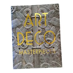 an art deco book with gold lettering on the front and back cover that reads, art deco masterpieces