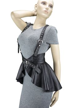 Black leather peplum harness made of soft sheep leather. With to its unique design, this harness will accentuate the waist and create a flattering feminine shape. Add this fashionable item to your wardrobe and you will not leave anyone indifferent! You can wear this corset as a piece of clothing or use it in role-playing games. Peplum length at back 12 inch ( 30 cm). If you want a peplum of a different length, please write to me! I can make a basque according to your individual measurements PROD Peplum Outfits, Harness Outfit, Black Leather Corset, Harness Belt, Leather Peplum, Peplum Skirt, Split Skirt, Underbust Corset, Leather Corset