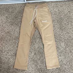 Brand New Never Worn Originally $130+ Slight Flare At Bottom Waist: 14” (Stretchy) Inseam: 30.5” Feel Free To Send Me An Offer! I Will Ship Out The Same Or Next Day Of Purchase! (: Sporty Beige Straight Leg Bottoms, Fitted Bottoms With Straight Hem For Streetwear, Beige Tapered Leg Bottoms For Streetwear, Stretch Beige Bottoms For Streetwear, Fitted Beige Pants For Streetwear, Sporty Beige Streetwear Bottoms, Sporty Beige Trousers, Men's Uniform, Men's Sweatpants