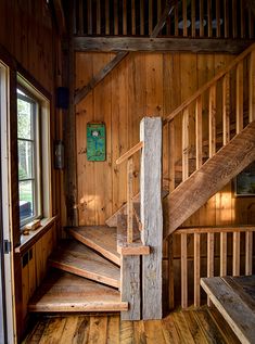 an old wooden staircase in a rustic cabin