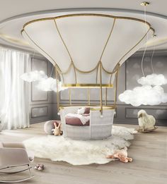 a child's room with a hot air balloon bed and rocking chair in it