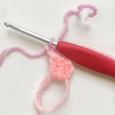 the crochet hook is being used to make an ornament