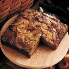 two slices of apple pie on a wooden plate