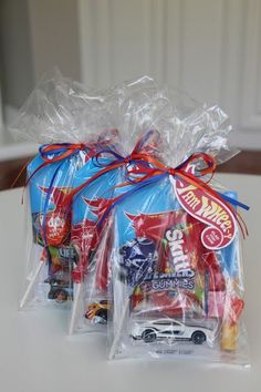 two bags filled with candy sitting on top of a table