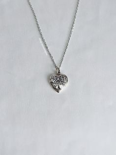 A versatile necklace featuring a sweet cherry heart charm on a non-tarnish 2mm rolo chain. The perfect addition to any jewelry collection. Our chains are 100% stainless steel and hypoallergenic so they won't rust, tarnish, or turn your neck green. - Sterling silver pendant - Will not rust or tarnish - Lobster clasp closure - Select desired size at checkout Silver Charm Necklace With Heart Beads And Pendant, Silver Double Heart Charm Necklace, Sterling Silver Charm Necklaces With Heart Beads For Gift, Sterling Silver Charm Necklace With Heart Beads For Gift, Silver Dainty Necklace With Heart Beads, Dainty Silver Heart Necklace With Heart Beads, Dainty Silver Heart Beaded Necklace, Nickel-free Heart Sterling Silver Charm Necklace, Nickel-free Sterling Silver Heart Charm Necklace