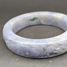 Style: Natural color lavender and green Jadeite bangle, intricately carved with flowers, master craftsmanship, intense lavender jadeite bangle Material: Intense lavender Jadeite, natural jadeite, Burmese jade, Lavender, natural color, estate sale Method: hand carved and polished, exquisite craftsmanship Type: Bangle, collectible, estate sale, one of a kind, vintage Size: 58mm x 15mm SKU: T22FG620-1 Elegant Carved Green Bangle, Elegant Jade Bangle, Luxury Green Jade Bangle, Jade Bracelet Bangles Chinese, Carved Green Jade Bangle, Flower Lei, Chinese Jewelry, Punk Vintage, Jade Bangle