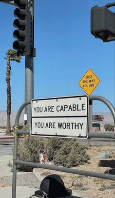 there is a sign that says you are capable if you are worthly on the street