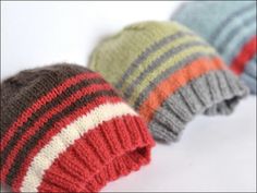 three knitted hats sitting next to each other