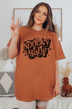 Spooky Season Shirt for Halloween Trick or Treat T-Shirt Product Details: ✿ Dreamy, Soft Fabric ✿ 100% Ring-spun Cotton ✿ Expertly Designed & Printed Sizing Details: ✿ Relaxed Fit  ✿ Size Up for Oversized Fit Recommended Care Practices: ✿ Cold Water Only ✿ Turn Inside Out to Wash ✿ Wash With Like Colors ✿ Tumble on Low Heat to Remove Wrinkles After Air Drying ✿ Do Not Iron Design Shipping & Processing: ✿ Please allow 2-7 business days for production. ✿ Please allow 2-7 business days for US Shipp Oversized Halloween Graphic T-shirt, Trendy Halloween Tops With Text Print, Orange Halloween T-shirt With Letter Print, Trendy Halloween Text Print T-shirt, Oversized Short Sleeve Halloween Tops, Halloween Orange T-shirt With Letter Print, Halloween Short Sleeve T-shirt With Text Print, Halloween Text Print Short Sleeve T-shirt, Spooky Oversized Top For Halloween