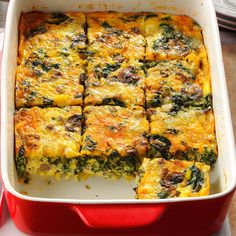 a casserole dish filled with spinach and cheese