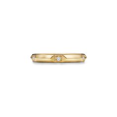 a yellow gold ring with a diamond in the center