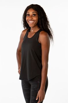 Designed with a Flattering open back detail that pairs Perfectly with all of our sports bras. We love it for running, weightlifting, yoga, and all cardio activities where staying cool is a must. The elevated neck-line was incorporated at the request of our fans. This is our loosest and most free fitting top yet! Cardio Activities, Back Details, Sports Bras, Weight Lifting, Cardio, Open Back, Sports Bra, Love It, Tank Top