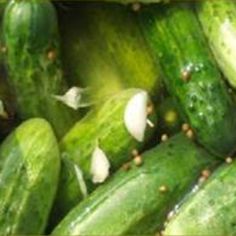 the cucumbers are green with brown spots on them