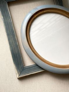 a close up of a framed object on a table