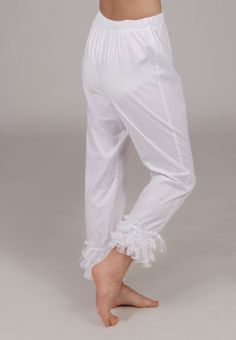 All cotton pantaloons are long and trimmed in three rows of flounced lace, finished with a satin ribbon. Elastic waist for comfort. Machine or hand wash on gentle cycle in cold water; Tumble dry on low setting or hang to dry. Proudly made in the US by Recollections. Please choose white, ivory, or black trim when ordering. Fitted Cotton Bottoms With Lace Trim, Daywear Stretch Bottoms With Ruffles, Stretch Ruffled Bottoms For Daywear, Cotton Ruffle Long Pants, Daywear Cotton Bloomers With Ruffles, Cotton Bloomers With Ruffles For Daywear, Fitted Ruffled Bottoms For Daywear, Fitted Ruffle Bottoms For Daywear, Stretch Cotton Pants With Lace Trim