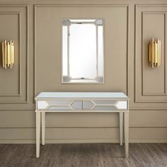 a white table sitting in front of a mirror on top of a wooden floor next to a wall