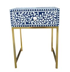 an ornate blue and white cabinet with gold trimmings on the bottom, sitting on a metal stand