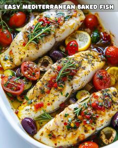 baked fish with tomatoes and olives in a white dish