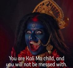 a woman with dark makeup and blue face paint on her face, has the words you are kali ma child, and you will not be messed with