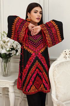 Aisha Imran. Ethnic Black Black Top With Intricate Embroidery, Traditional Black Kurta For Spring, Black Resham Embroidered Kurta For Spring, Black Cotton Tops For Eid, Multicolor Embroidered Tops For Eid, Black Cotton Blouse With Geometric Embroidery, Black Embroidered Sets For Spring, Black Cotton Top With Geometric Embroidery, Black Embroidered Tunic Blouse