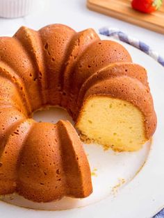 a bundt cake on a plate with one slice cut out