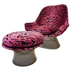 an animal print chair and ottoman with pink velvet upholstered fabric on the top