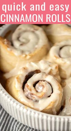 cinnamon rolls with icing in a white bowl on a striped cloth and text overlay